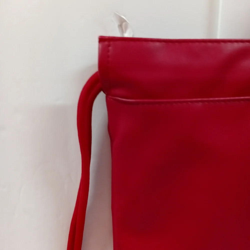 JORDAN Red Faux Leather Drawstring Backpack with Gold Jumpman